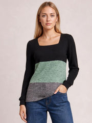 Model wears a color block square neck long sleeve T-shirt with black sleeves and bodice, sage green and gray panels, and a fitted silhouette.