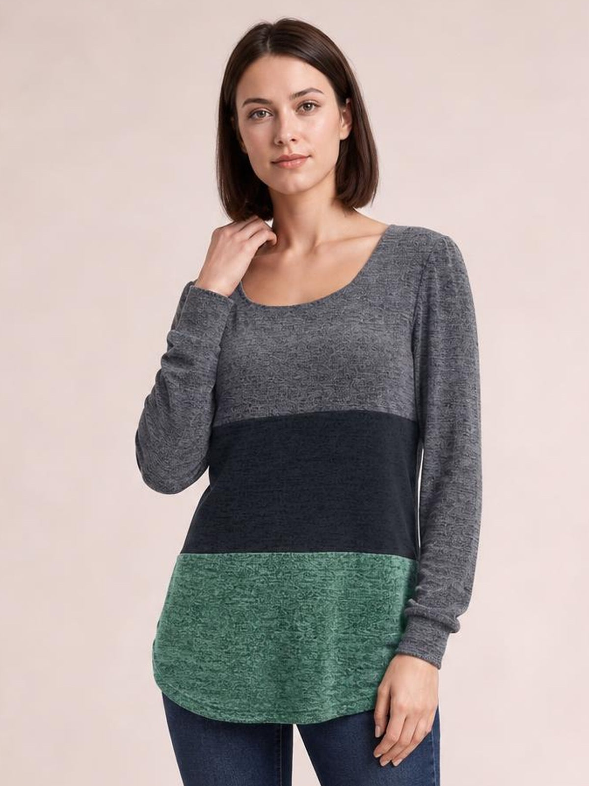 Model wears a gray, black, and green color block long sleeve T-shirt with a square neckline and relaxed, curved-hem silhouette.