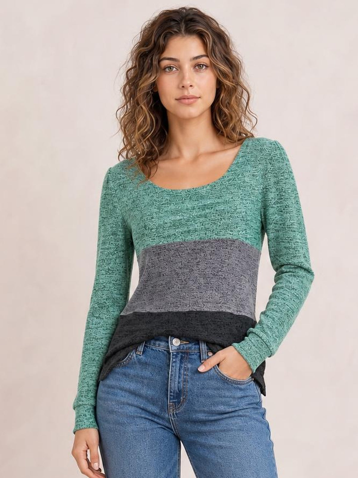 Model wears a fitted color block long sleeve T-shirt with a square neckline, green sleeves and upper panel, gray center, and black hem.