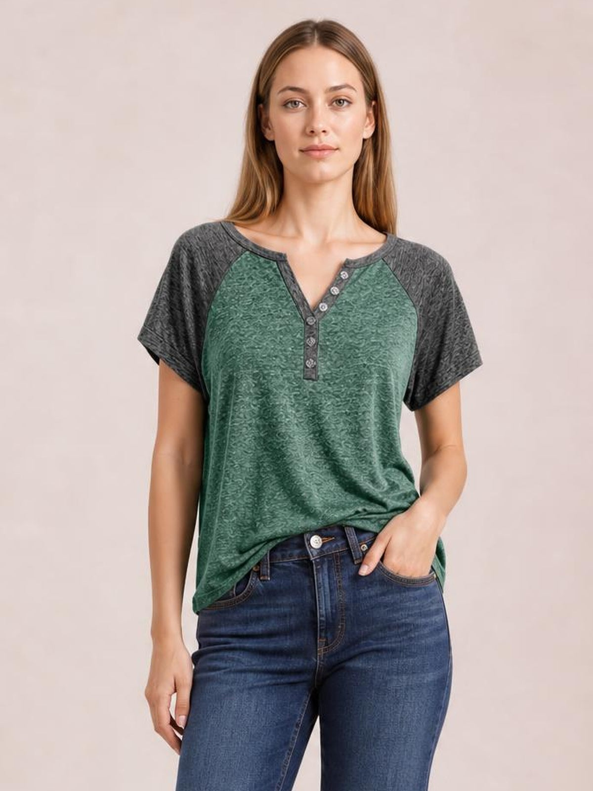 Model wearing a green Contrast Notched Short Sleeve T-Shirt with dark contrast sleeves, a notched neckline, decorative button placket, and relaxed silhouette.