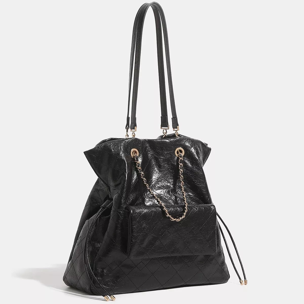 Large black PU leather convertible drawstring backpack with a slouchy silhouette, quilted lower panel, front pocket, chain accents, and long shoulder straps.