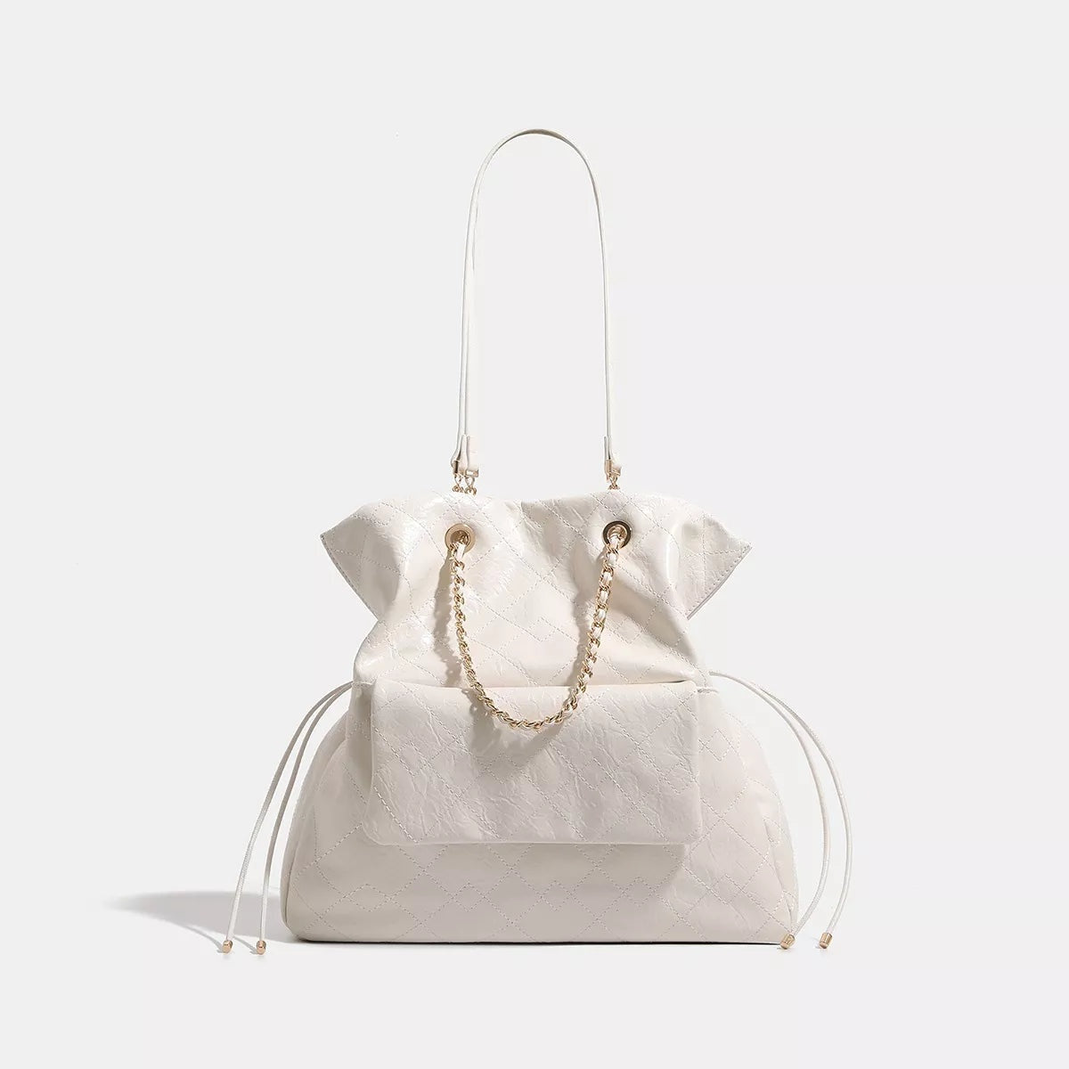 Large white PU leather convertible drawstring backpack bag with diamond quilting, a structured silhouette, long shoulder strap, and decorative chain detail.