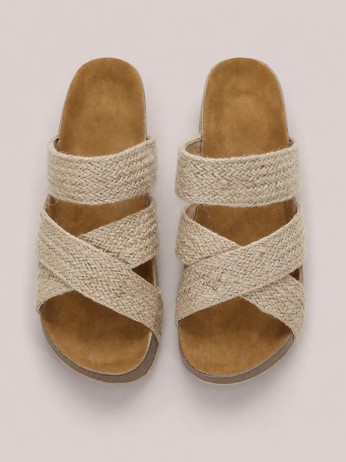 Beige crisscross open toe platform sandals with wide woven straps, cushioned footbeds, and layered flat soles.
