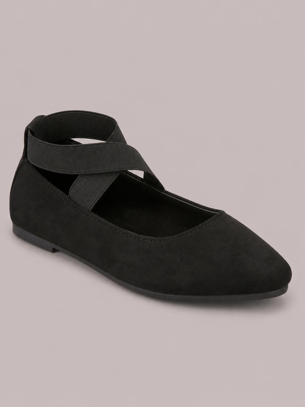 Black suede crisscross point-toe flats feature a sleek slip-on silhouette, low flat sole, and clean stitched construction.