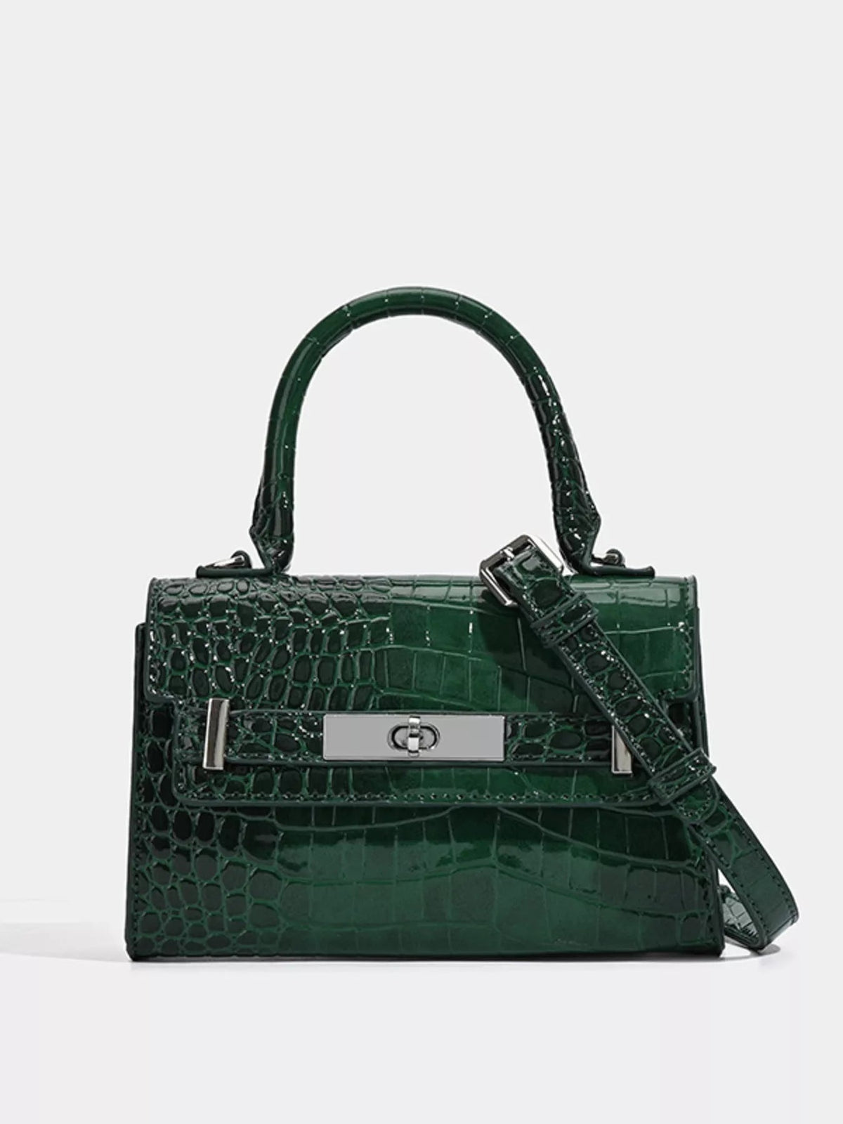 Small dark green PU leather handbag with glossy croc embossing, a structured silhouette, top handle, silver turn-lock, and adjustable shoulder strap.