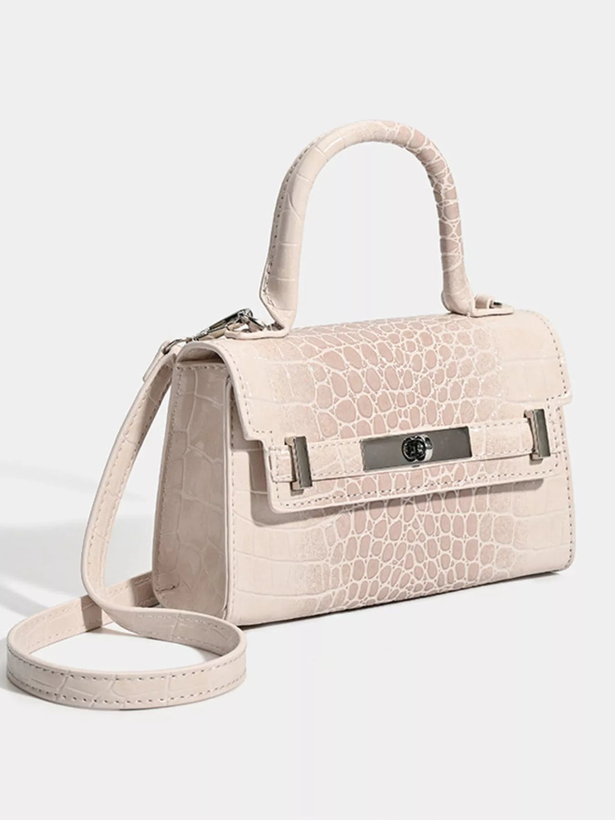 Small pale beige PU leather handbag with a structured silhouette, croc-embossed finish, top handle, flap closure, metal turn-lock, and long shoulder strap.