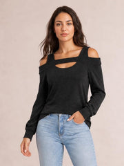 Front-facing model wears a solid black cutout cold-shoulder top with a square neckline, long sleeves, and a relaxed regular-length silhouette.