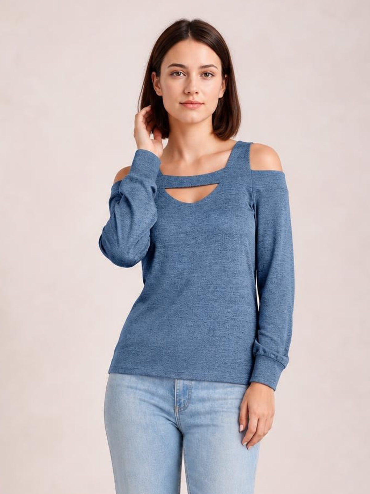 Model poses in a blue solid cutout cold-shoulder top with a square neckline, long sleeves, and a regular straight silhouette.