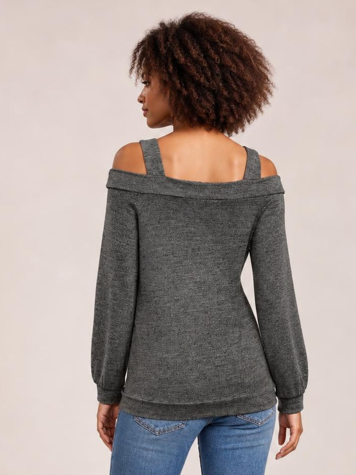 Model shown from behind in a gray solid cutout cold-shoulder top with long sleeves, exposed shoulders, shoulder straps, and a relaxed regular-length silhouette.