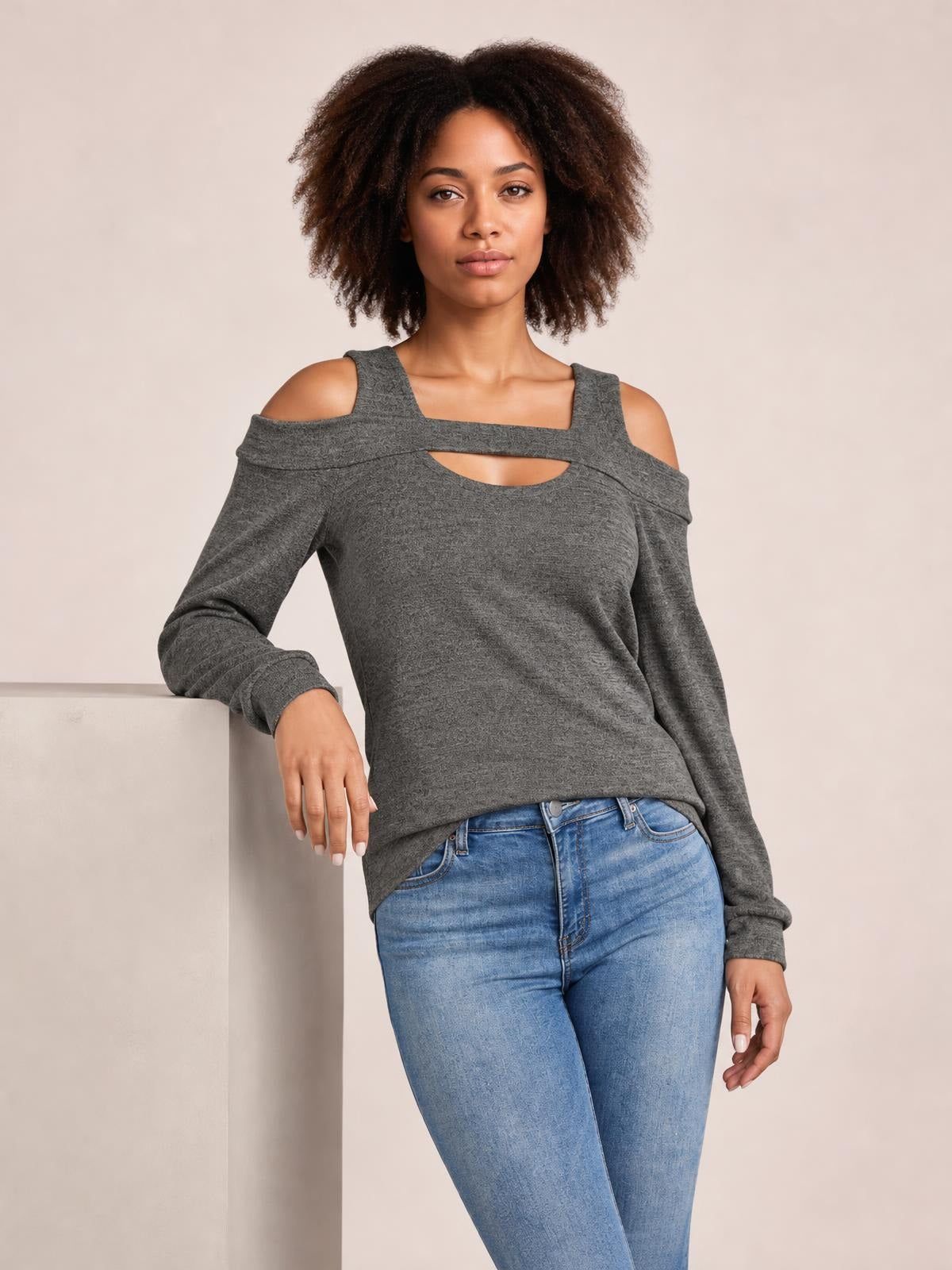 Model wearing a solid gray cutout cold-shoulder top with a square neckline, long sleeves, shoulder straps, and a relaxed regular-length silhouette.