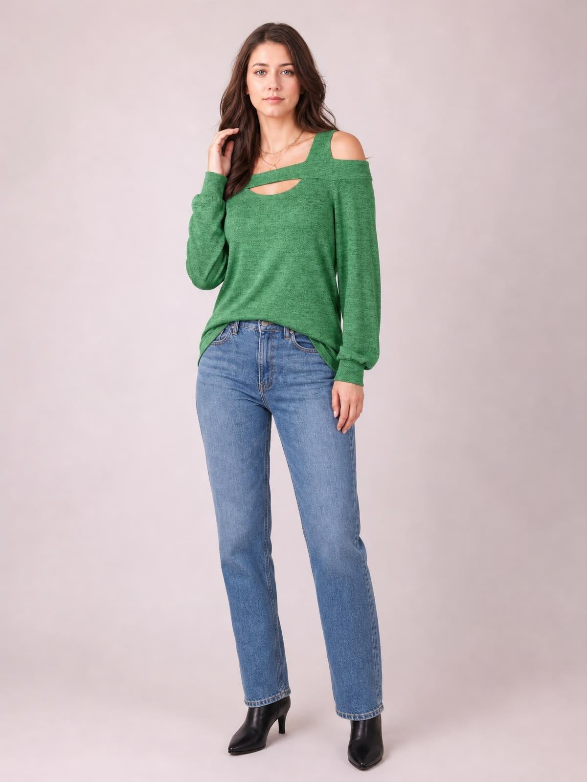 Model poses in a green solid cutout cold-shoulder top with a square neckline, long sleeves, regular length, and a relaxed silhouette.