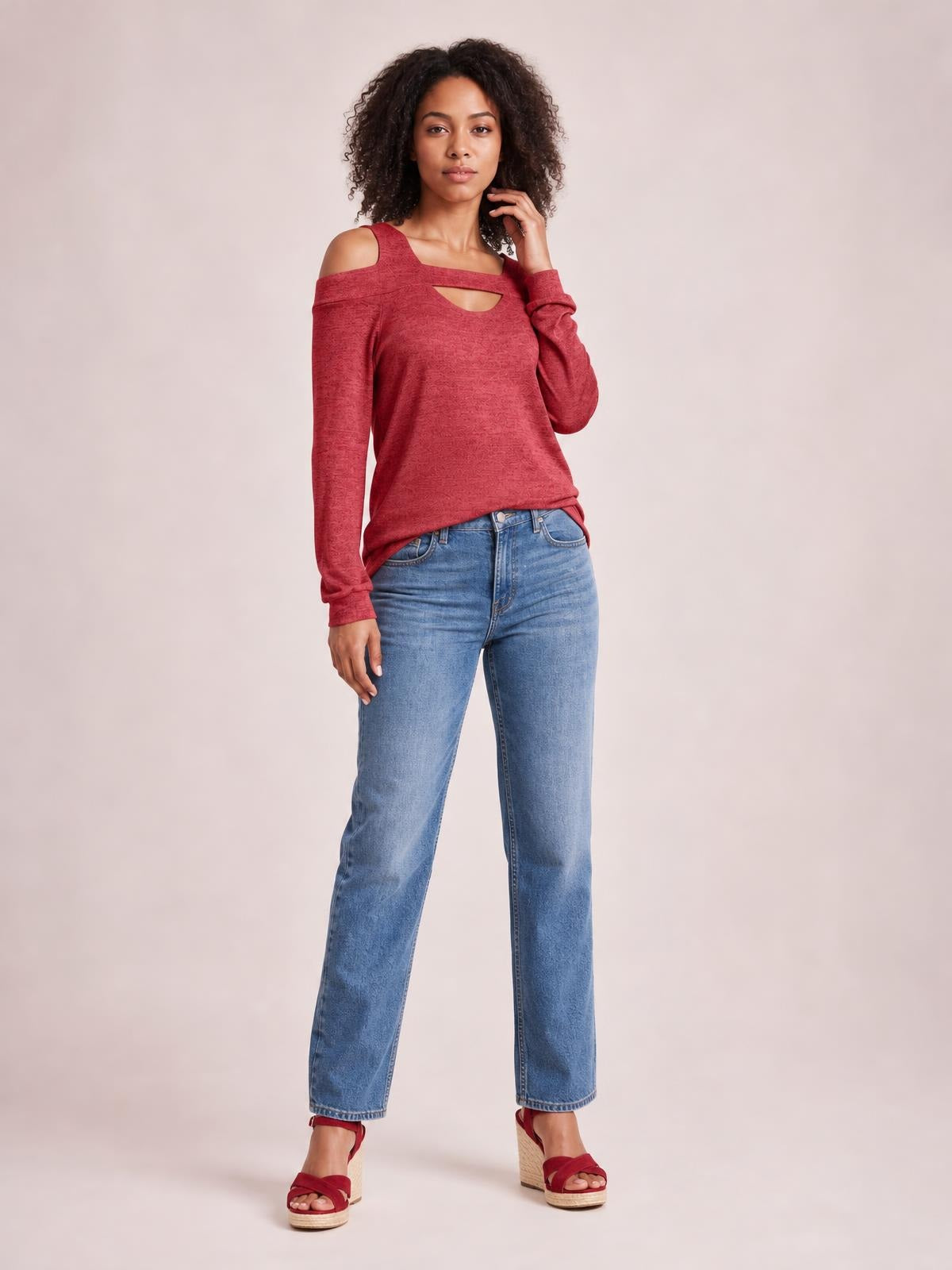 Model poses in a red solid cold-shoulder top with long sleeves, square neckline, chest cutout, and a regular-length silhouette.