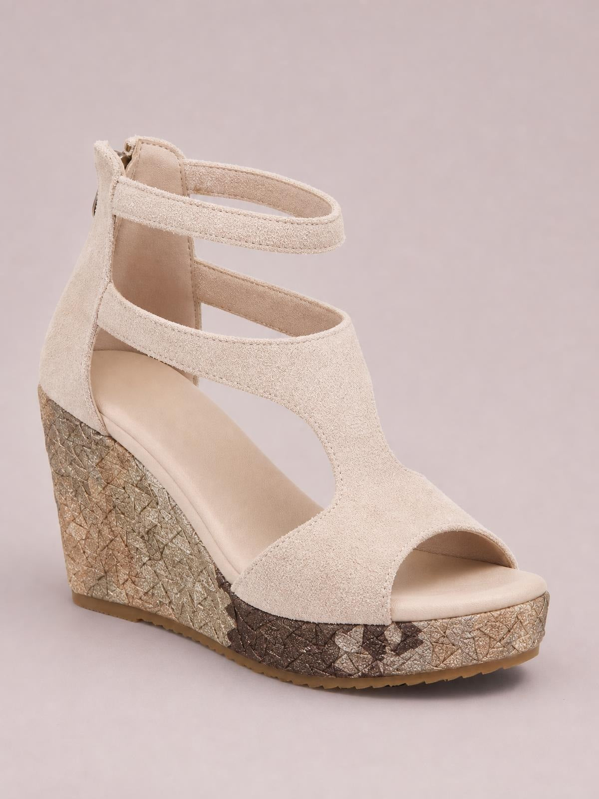 Beige cutout wedge platform sandal with an open toe, ankle strap, wide front band, and textured high wedge heel with a patterned platform sole.