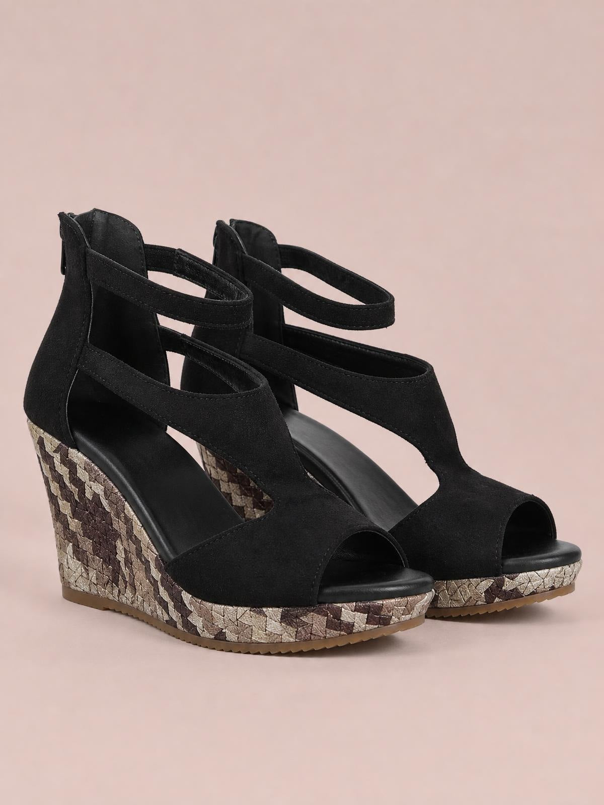 Black cutout wedge platform sandals feature peep toes, ankle straps, wide front panels, textured woven wedge heels, and rubber soles.