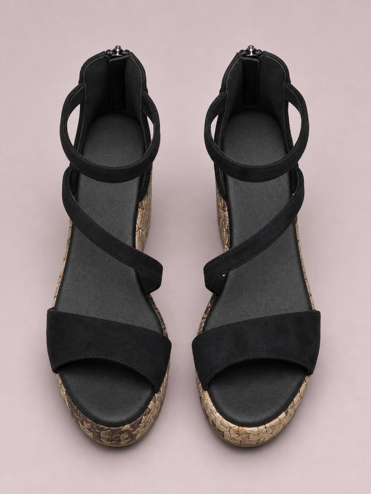 Black cutout wedge platform sandals feature wide open-toe straps, wraparound ankle bands, and textured gold-tone high wedge soles.