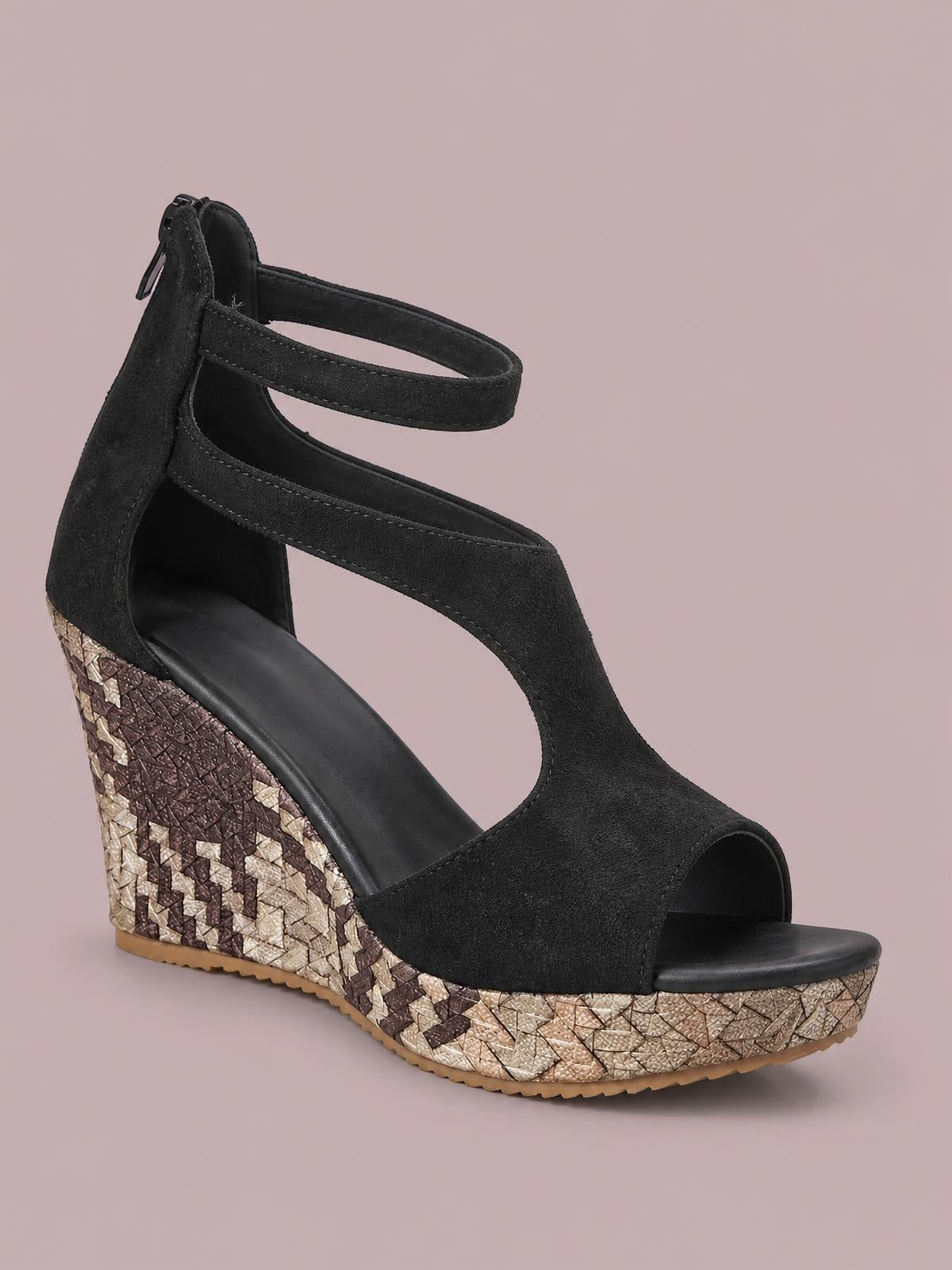 Black cutout wedge platform sandal with an open toe, ankle straps, textured upper, high wedge heel, and patterned platform rubber sole.