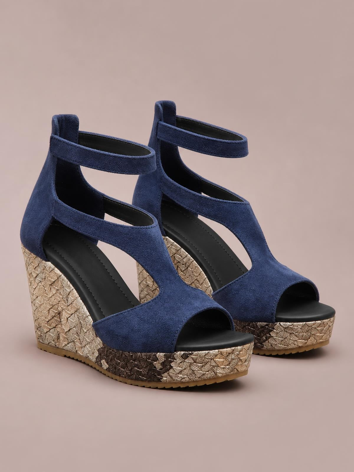 Navy blue cutout wedge platform sandals feature open toes, ankle straps, and tall textured wedge heels with contrasting metallic woven platforms.