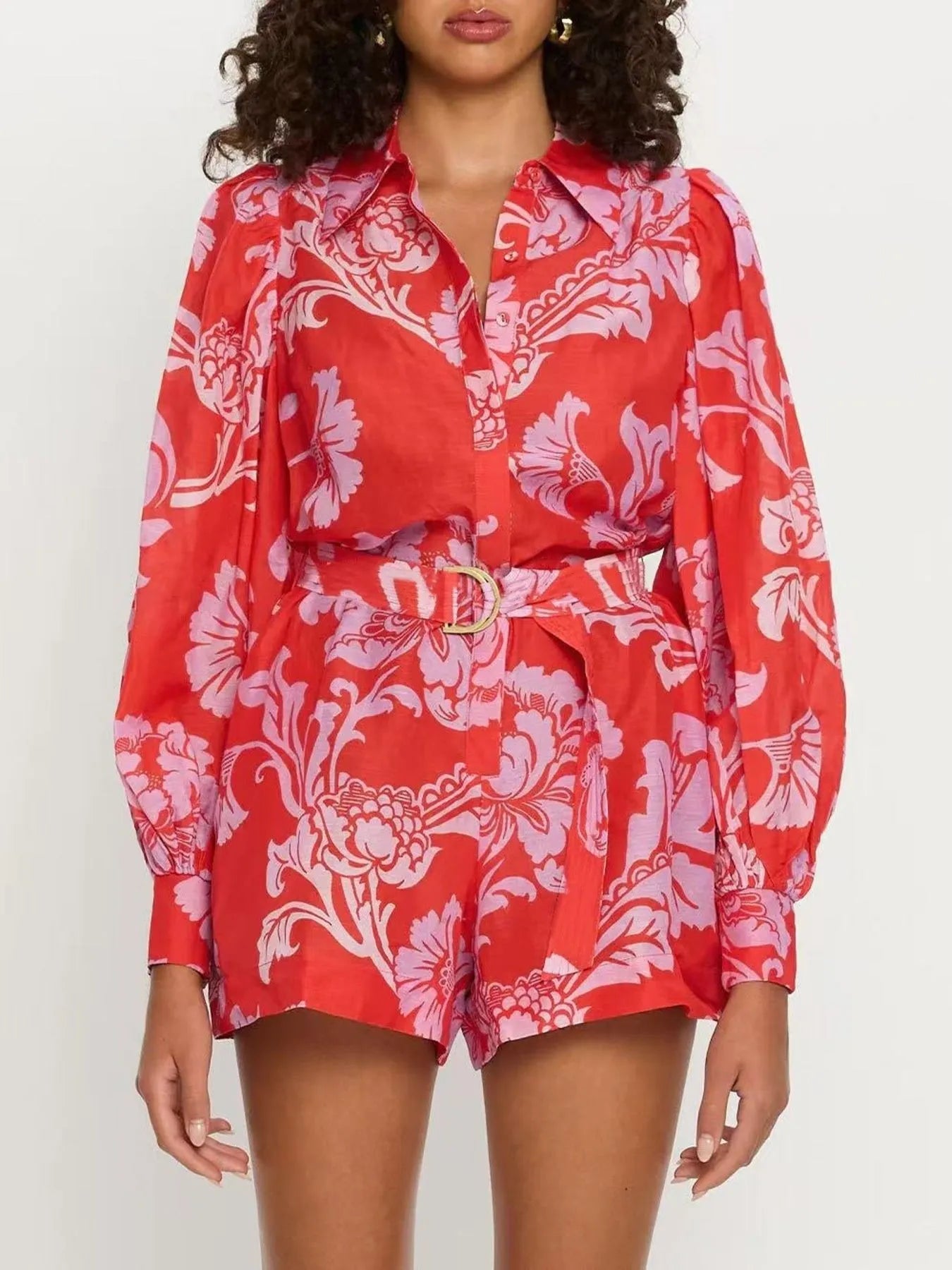 Printed Long Sleeve Belted Romper with Tie and Buttons.