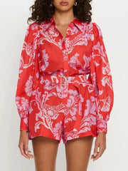 Printed Long Sleeve Belted Romper with Tie and Buttons.