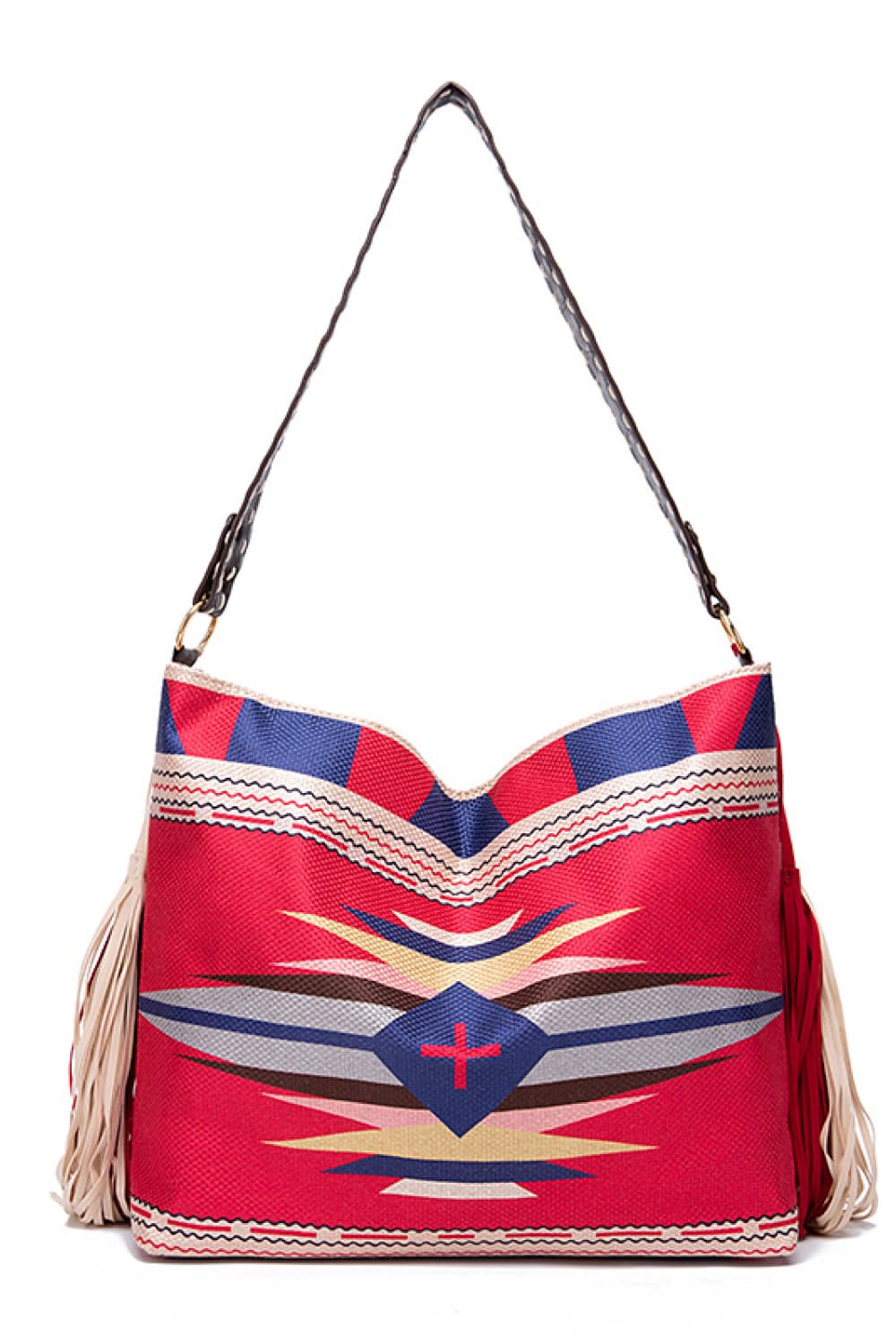 Oversize geometric canvas tote bag in red with colorful tribal-inspired patterns, a long shoulder strap, structured rectangular silhouette, and side tassel details.