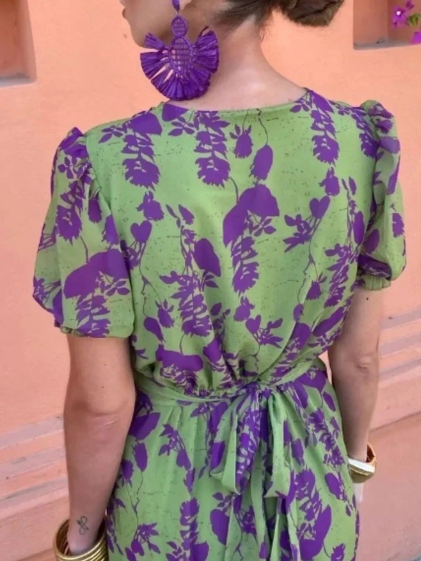 Green floral print midi dress with purple flowers, V-neckline, puff sleeves, and a fitted waist