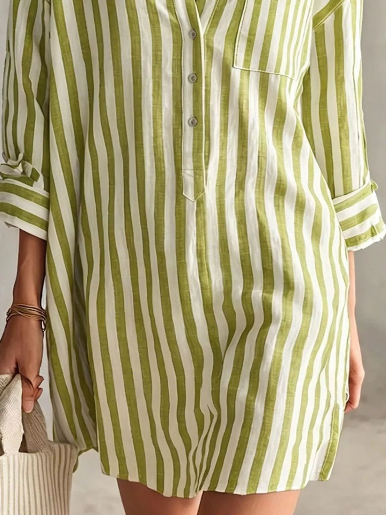 Plus-size blue and white striped shirt mini dress with button front, chest pocket, and rolled sleeves