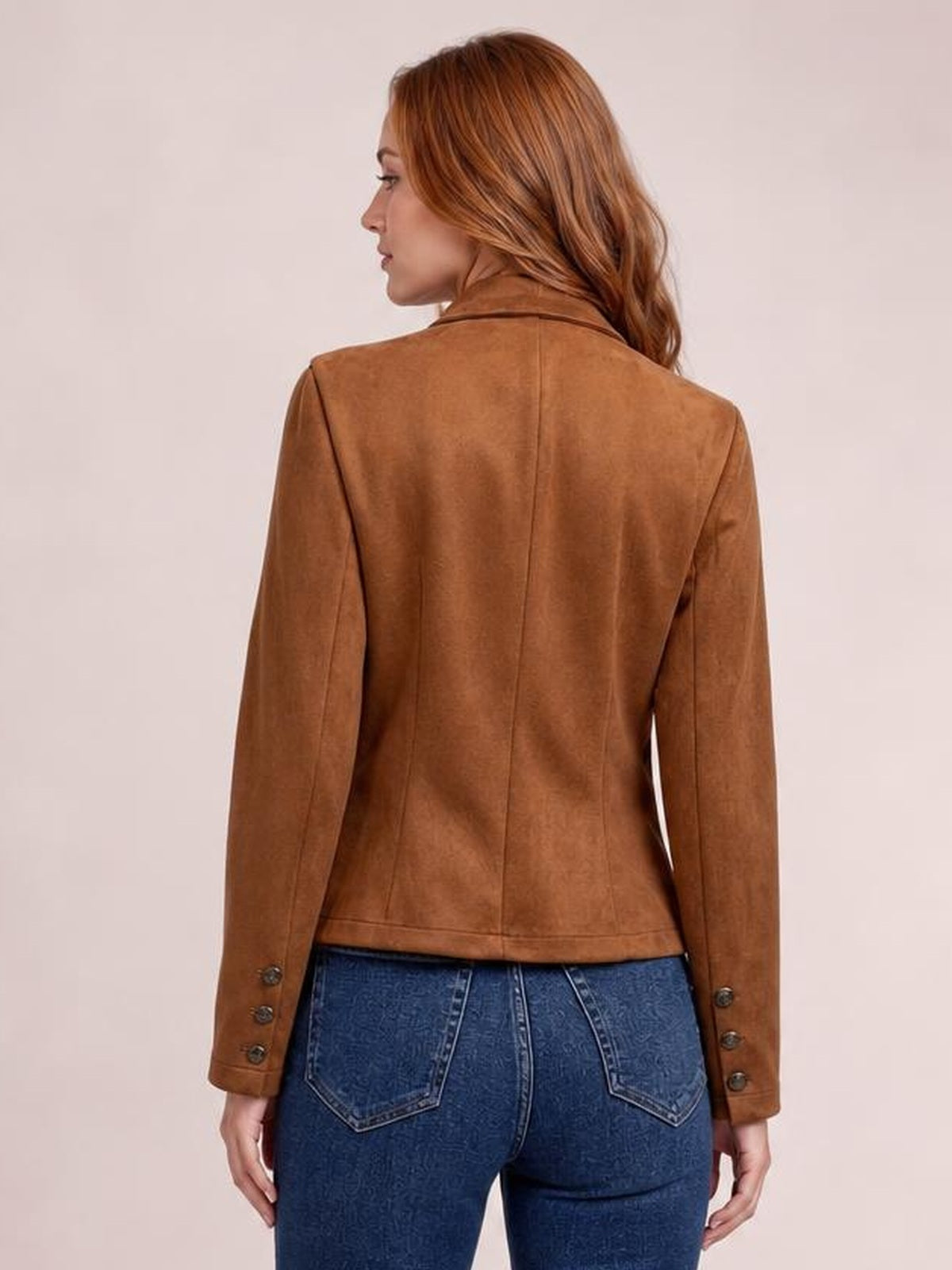 Model shown from the back wearing a fitted brown open-front jacket with long sleeves, seam detailing, and decorative buttons at the cuffs.