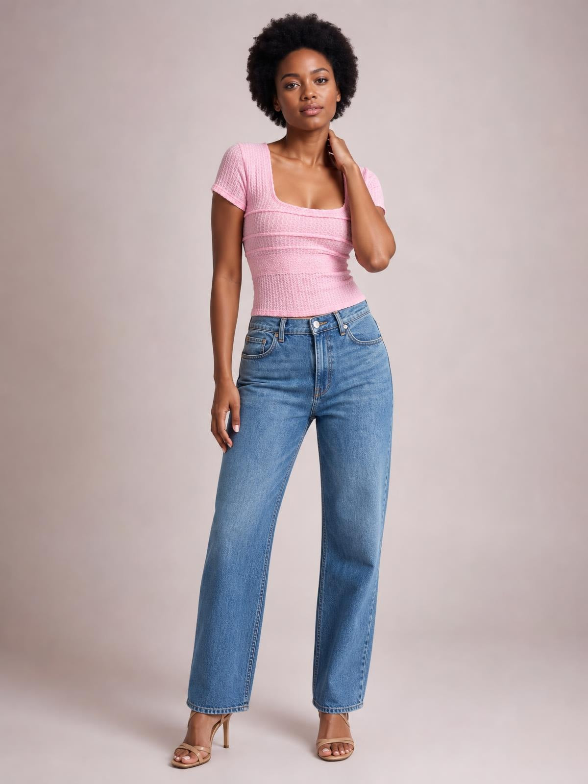 A model poses in a pink fitted lace-detail square-neck short-sleeve T-shirt with a sculpted silhouette and textured horizontal construction.