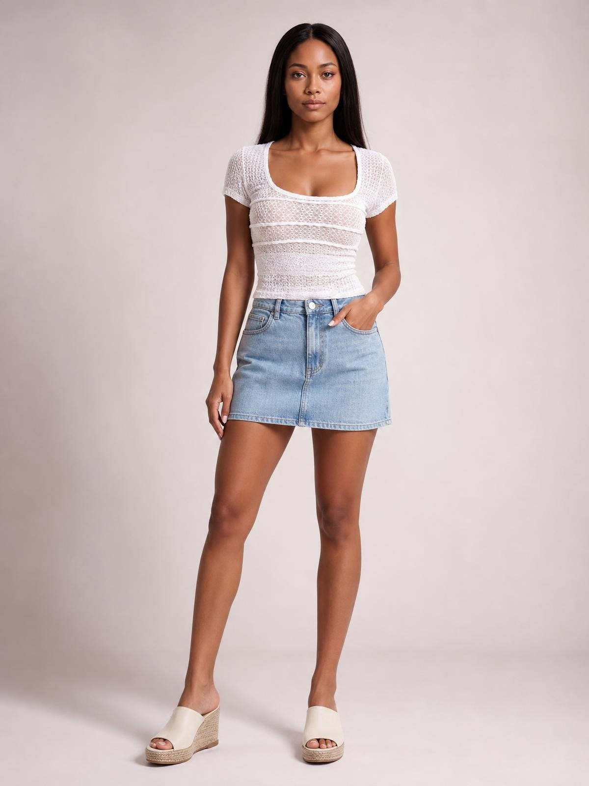 Model wearing a white lace-detail T-shirt with a square neckline, short sleeves, tied construction, and fitted silhouette.