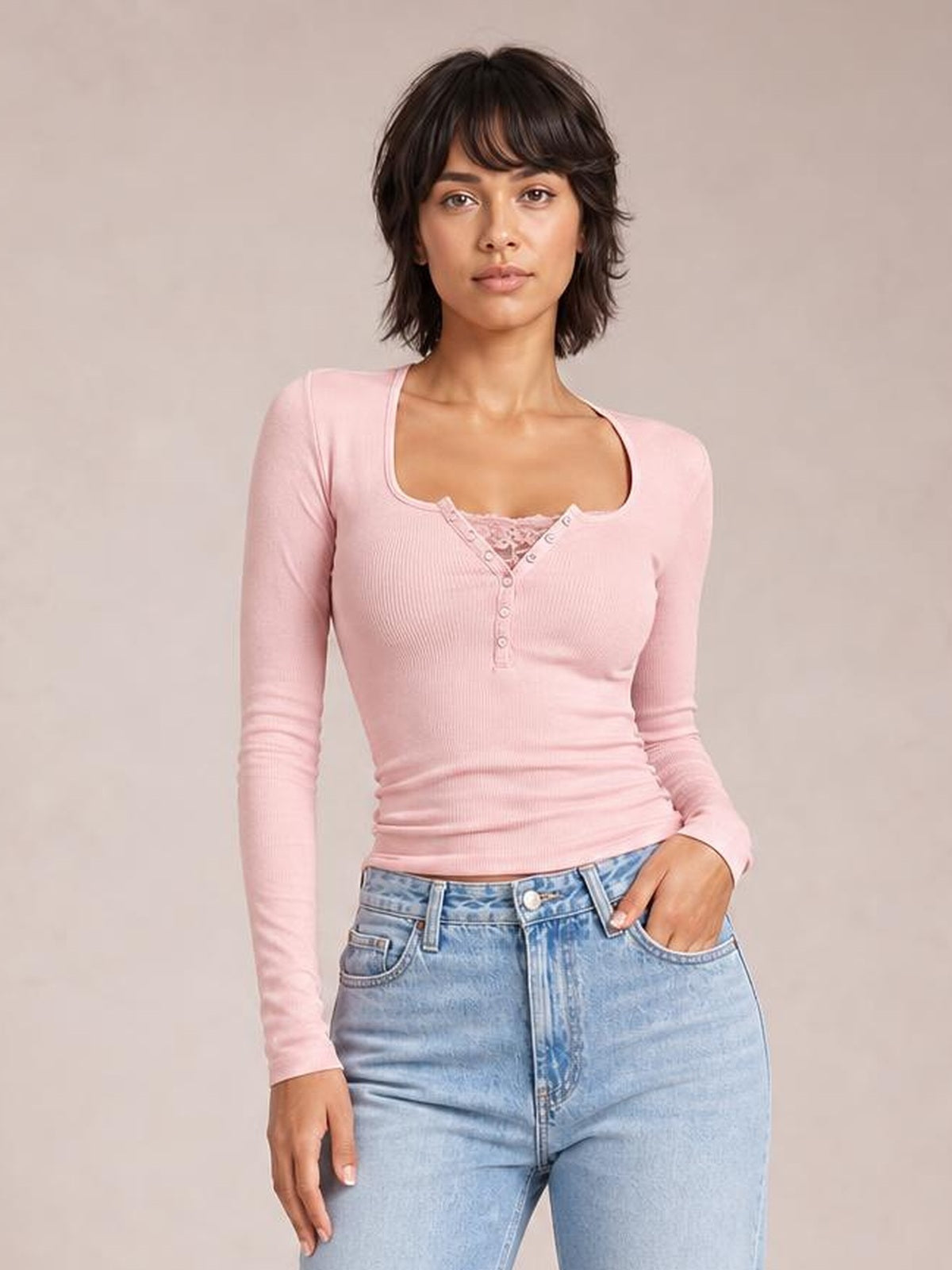 Model poses in a fitted pink square-neck long-sleeve T-shirt with a buttoned half-snap placket and ribbed stretch construction.