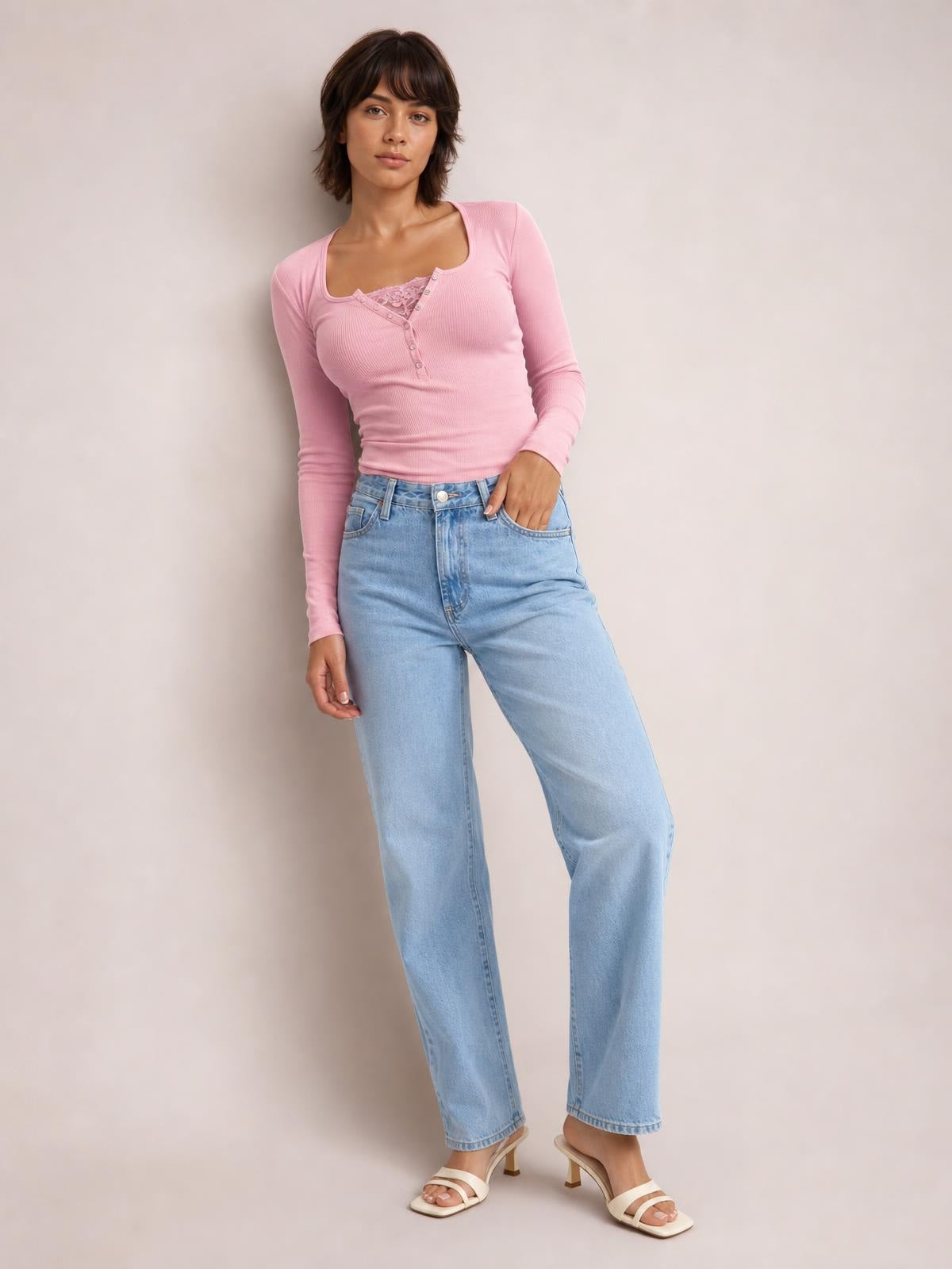 Model wears a fitted pink square-neck long-sleeve T-shirt with a half-snap button placket, ribbed construction, and a slightly cropped silhouette.