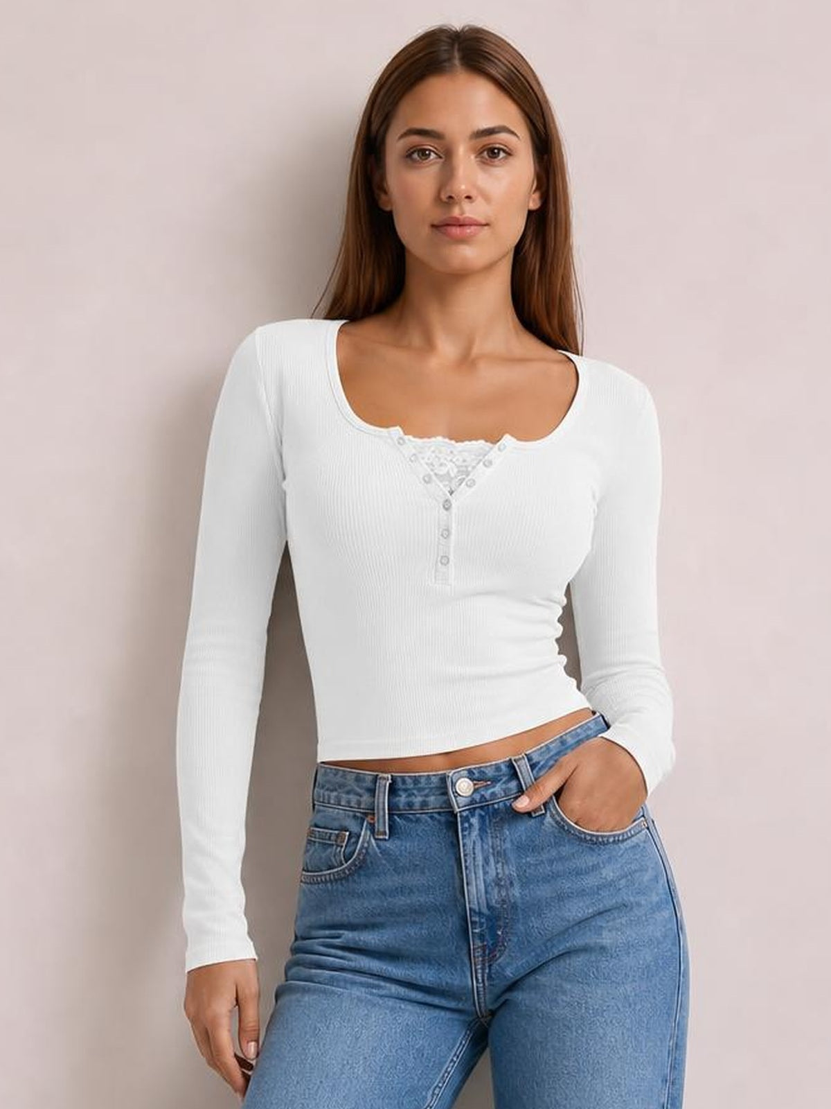 Model wears a fitted white ribbed long sleeve T-shirt with a square neckline, lace-trimmed half-snap button placket, and cropped silhouette.