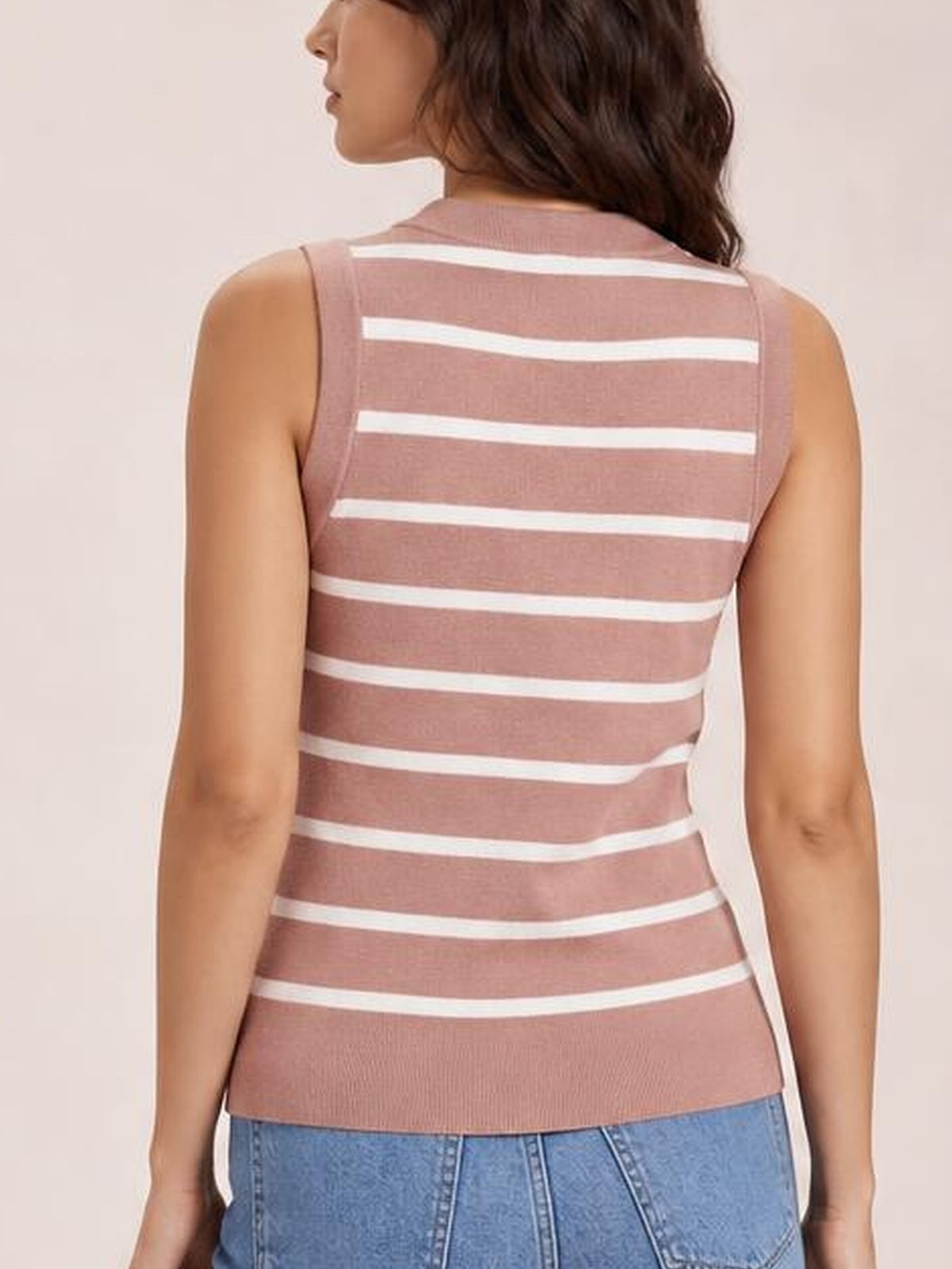 Model shown from the back in a dusty pink striped knit tank with white horizontal stripes, wide shoulder straps, and a fitted silhouette.
