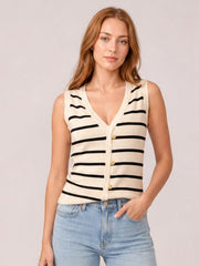 Model poses in a cream striped V-neck knit tank with a fitted sleeveless silhouette, button-front construction, and black horizontal stripes.