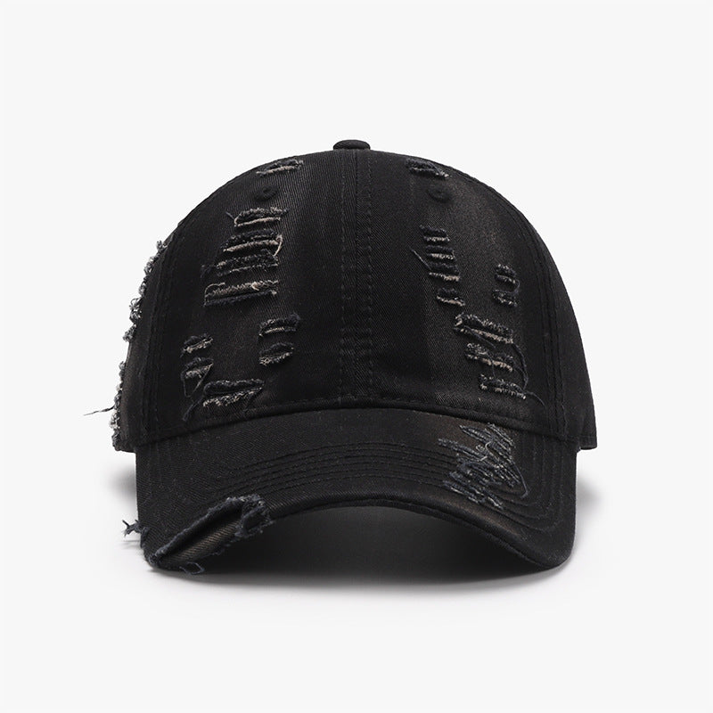 Black distressed cotton baseball cap with a six-panel crown, gently curved brim, tonal stitching, and frayed details across the crown and brim.