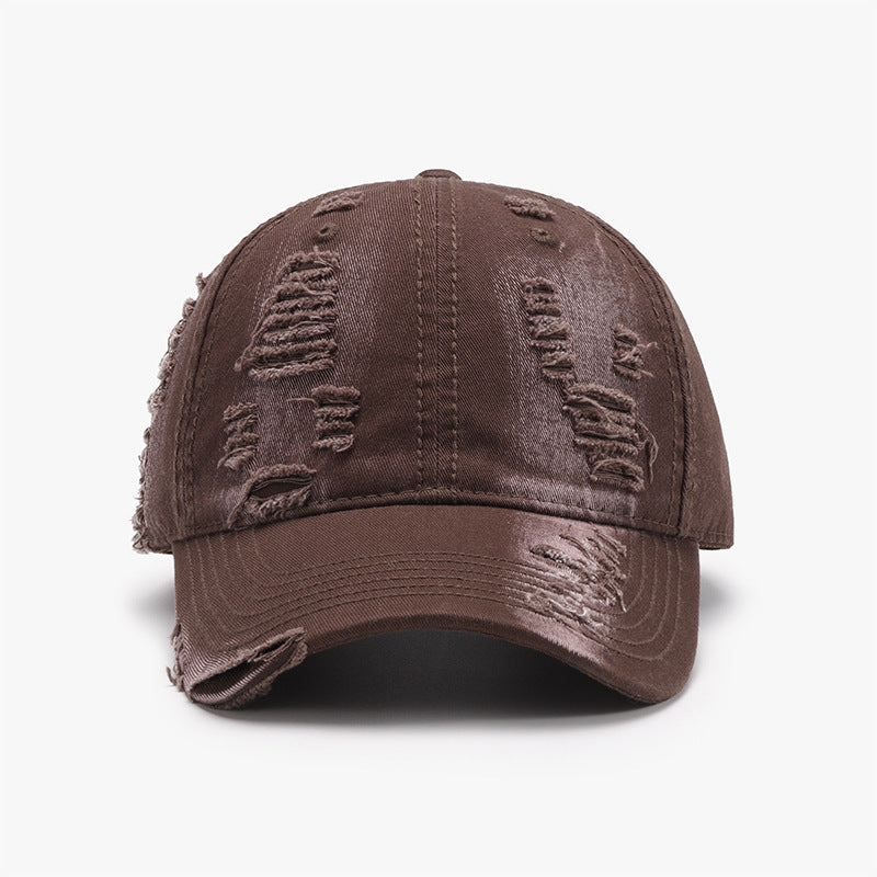 Distressed brown cotton baseball cap with a classic six-panel crown, curved brim, tonal stitching, and frayed details across the crown and visor.