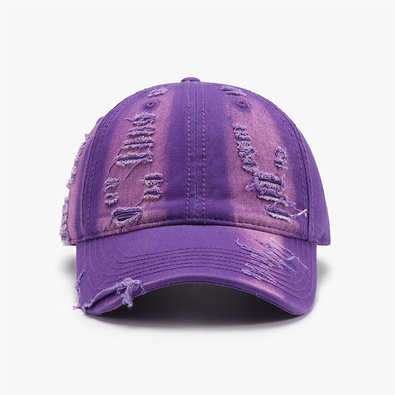 Purple distressed cotton baseball cap with a classic six-panel silhouette, curved brim, tonal stitching, and frayed details across the crown and brim.
