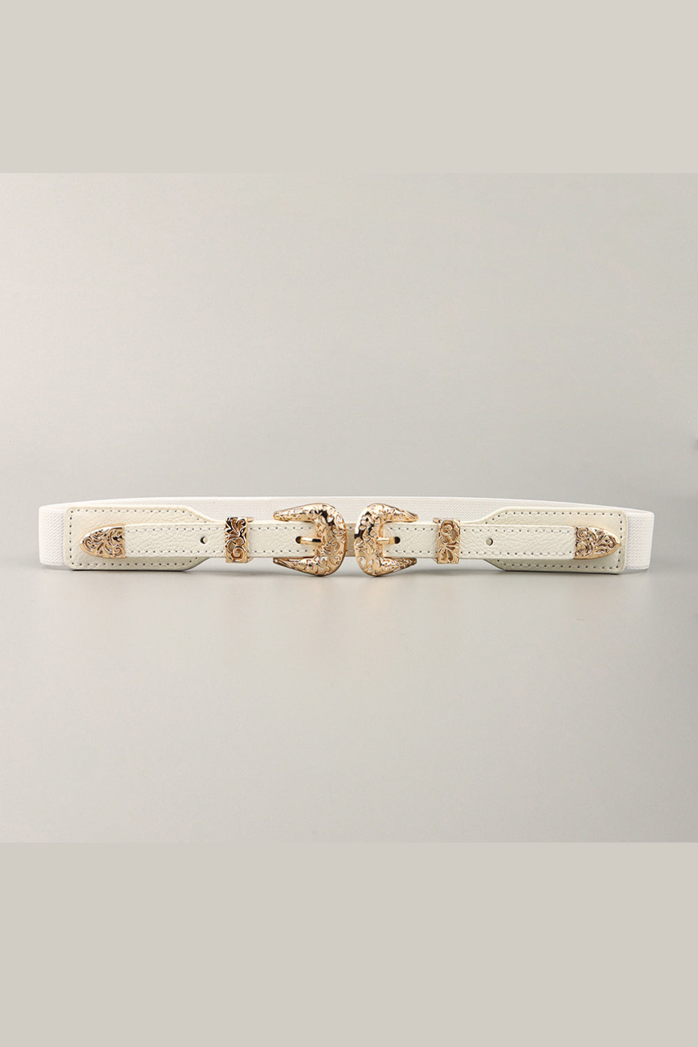 White 1-inch elastic Double Buckle Belt with ornate gold-tone alloy buckles, stitched PU panels, pointed ends, and a flexible waist-defining design.