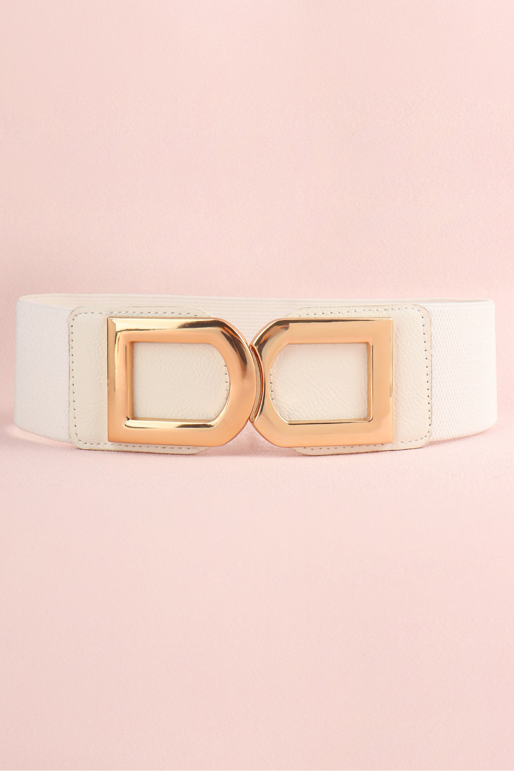A white PU belt with a smooth, stitched body and polished gold-tone alloy double D buckle in a structured statement design.