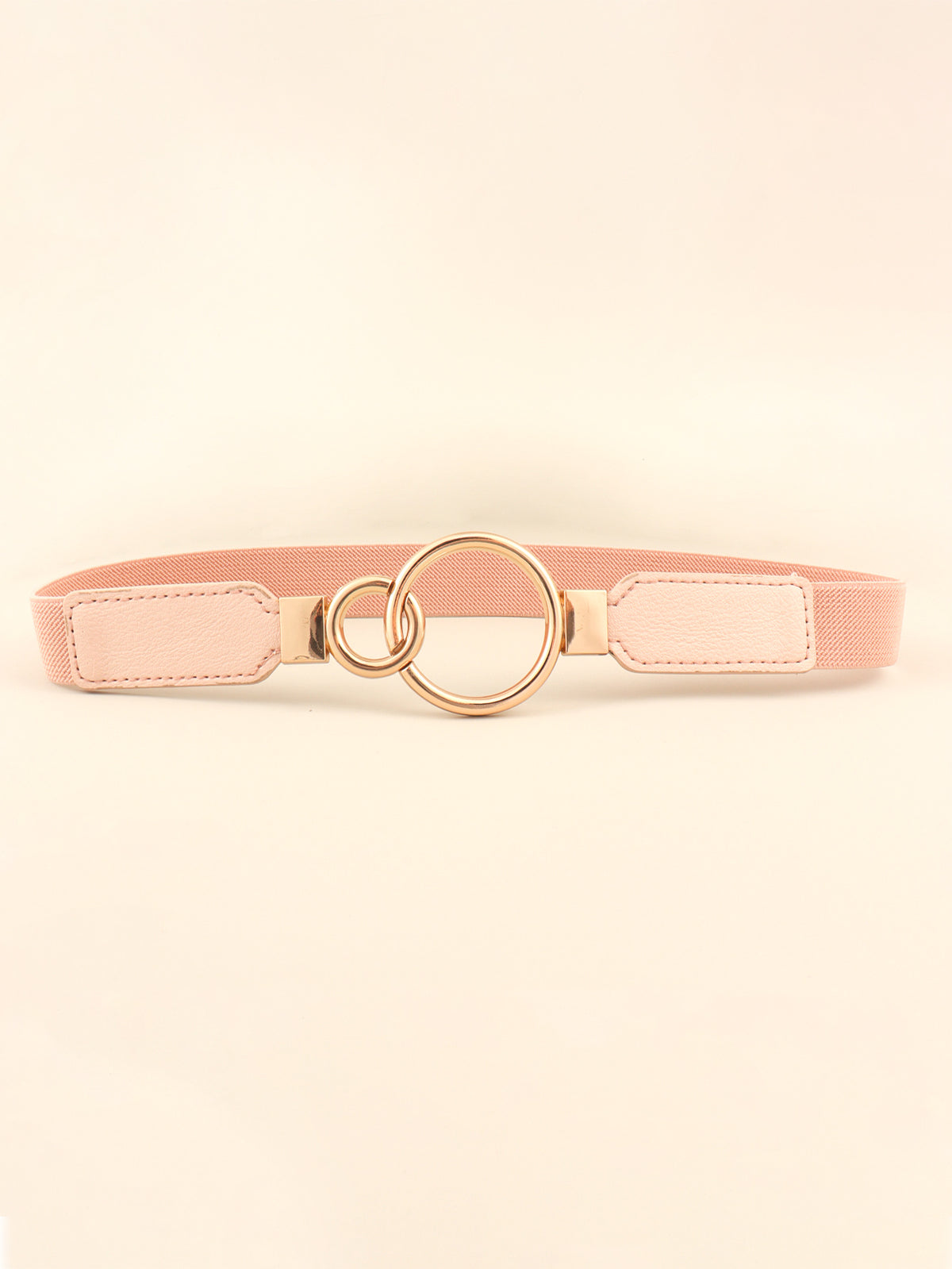 Blush pink elastic PU belt with stitched end panels and a polished gold-tone double-ring buckle.