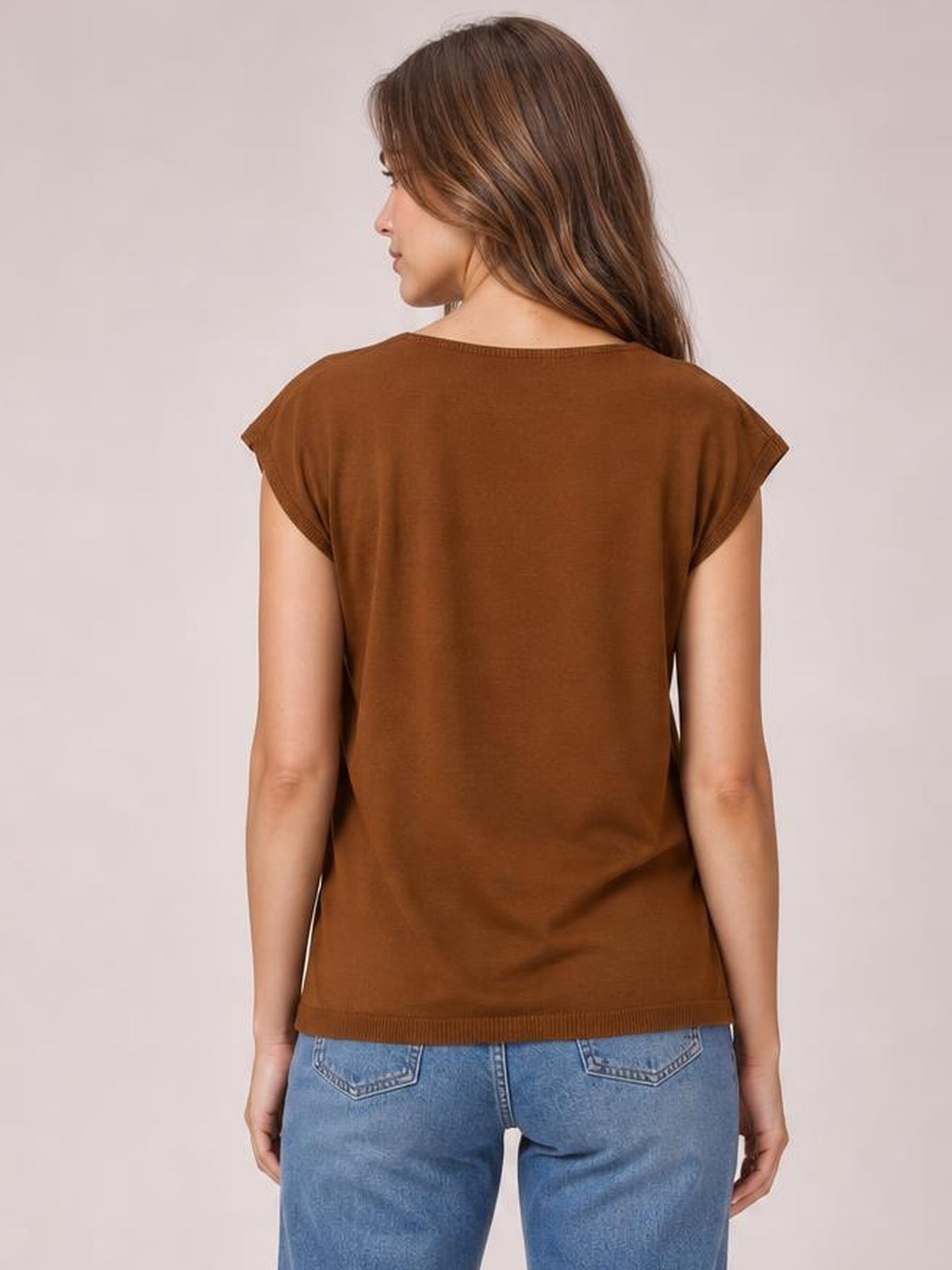 Model shown from the back wearing a brown knit top with cap sleeves, a relaxed straight silhouette, round neckline, and ribbed hem.