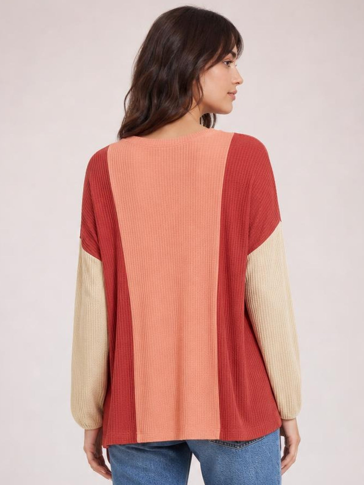 Model shown from behind wearing an opaque color-block texture contrast long sleeve T-shirt with a round neck, relaxed silhouette, and ribbed construction.