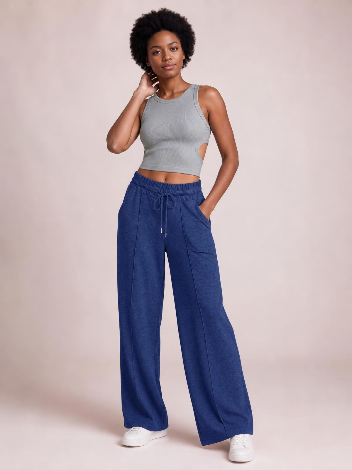Model poses in navy Drawstring Elastic Waist Wide Leg Pants with a relaxed flowy silhouette, adjustable drawstring, elastic waistband, and side pockets.