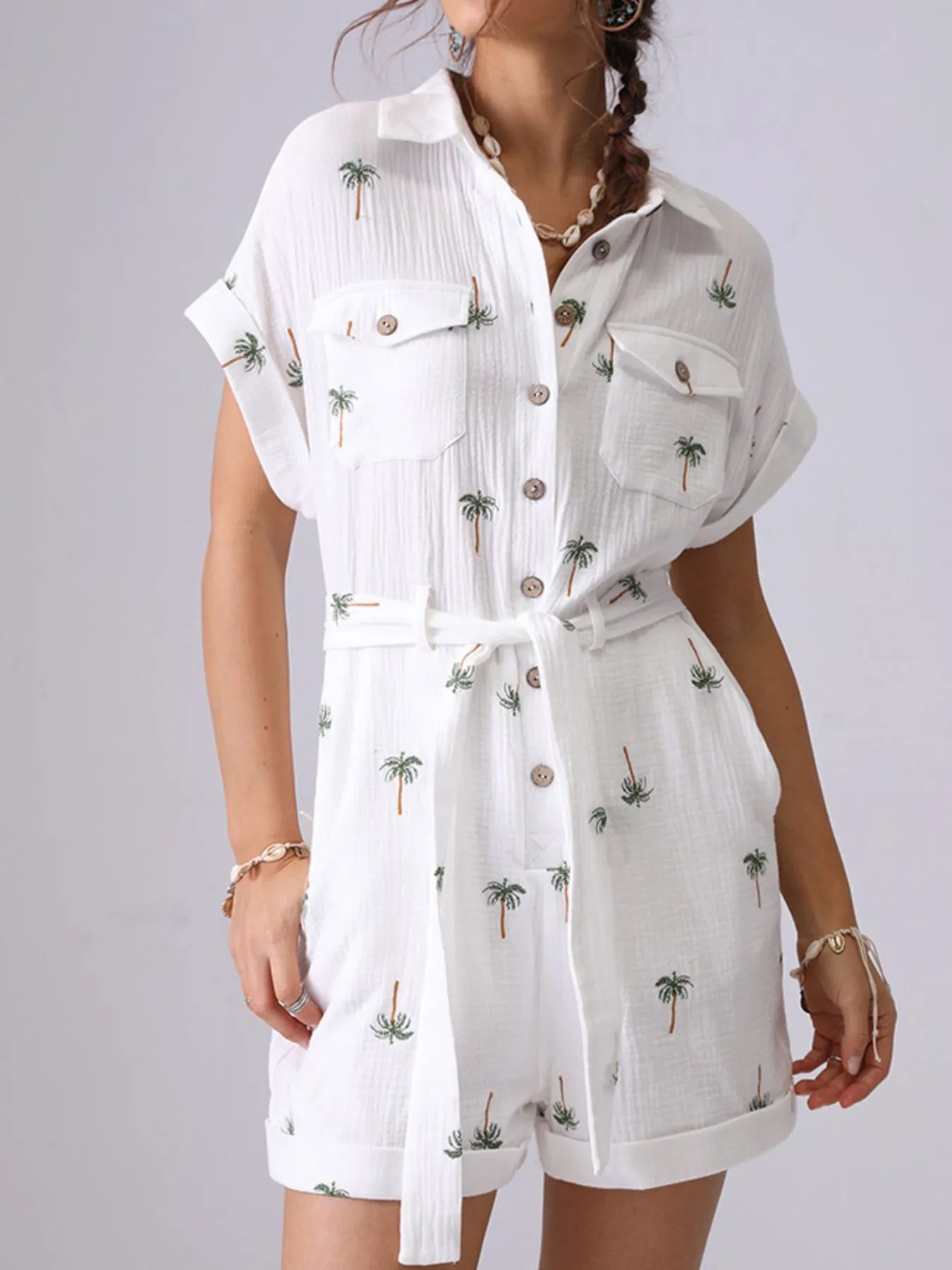 Palm Tree Print Short Sleeve Button-Up Romper with Belt and Pockets.