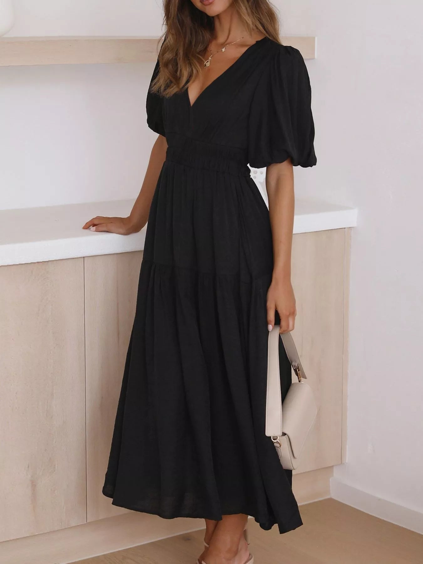 Cream tiered midi dress with a V-neck, smocked waist, and short puff sleeves