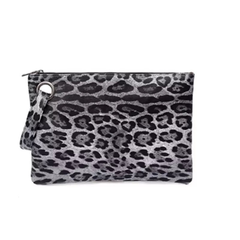 Small rectangular PU leather clutch bag with a black-and-gray leopard print, zip-top construction, and a matching wrist strap.