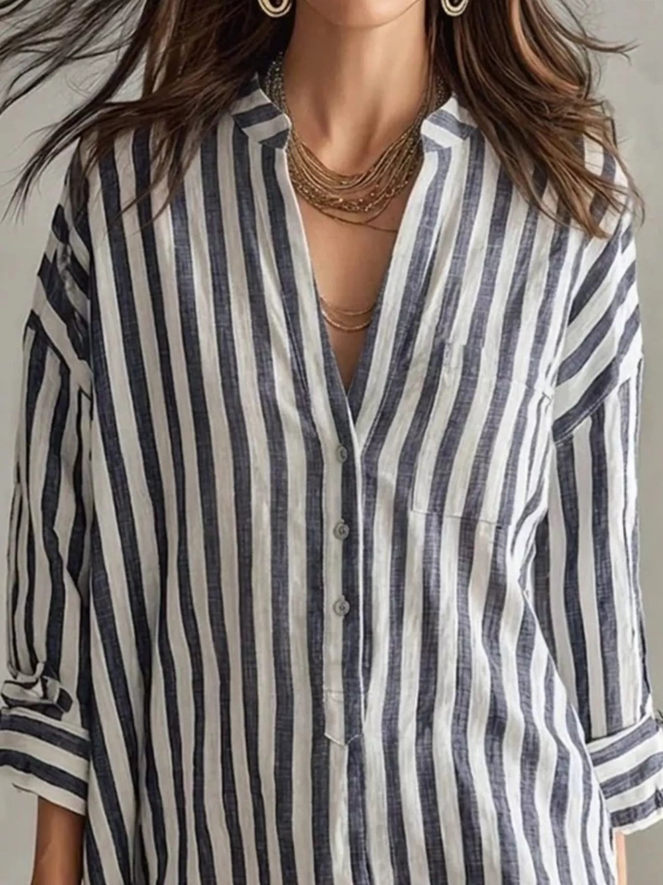 Plus-size blue and white striped shirt mini dress with button front, chest pocket, and rolled sleeves