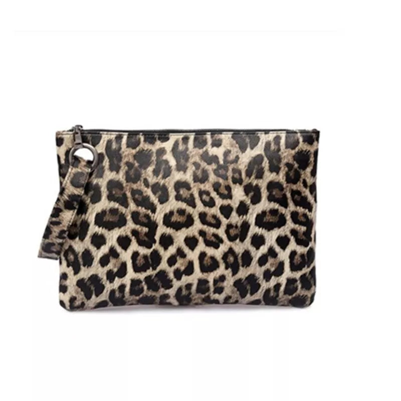 Small PU leather leopard print clutch bag with a rectangular silhouette, top zip closure, and attached wrist strap.