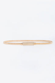 Slim gold-tone elastic iron belt shown laid flat, featuring a sleek narrow silhouette and structured rectangular buckle with clean understated construction.