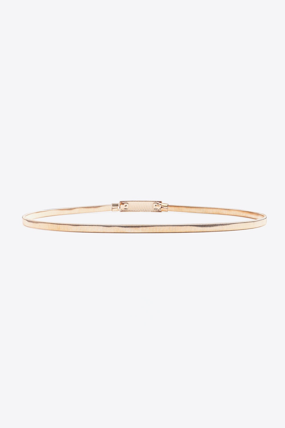 A slender rose-gold elastic iron skinny belt is displayed flat, showing its streamlined profile and structured rectangular buckle with hinged construction.